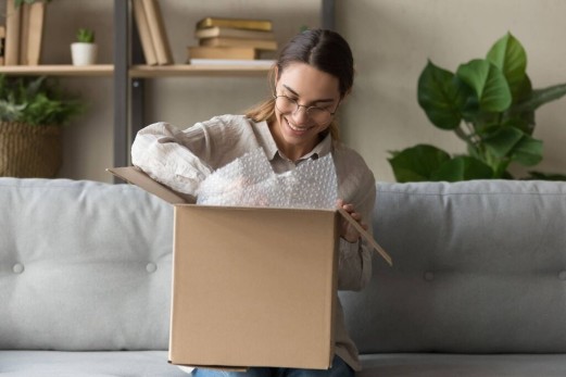 Woman smiling at package