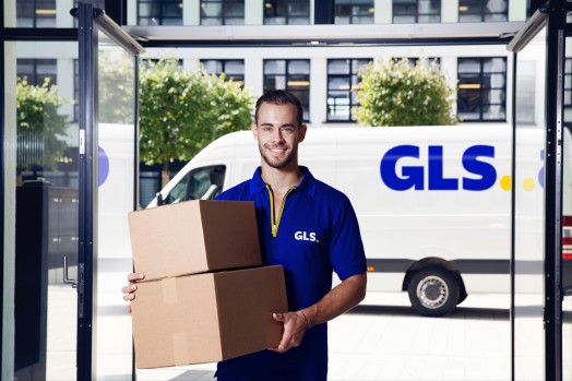 driver with parcels in a parcel shop