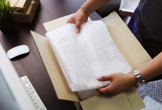 parcel being packed with inner packaging for safe delivery