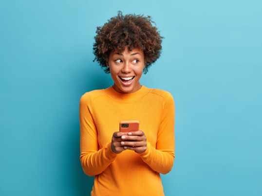 girl happy to read positive news