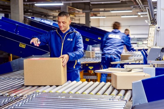 GLS delivery driver in the warehouse of a client