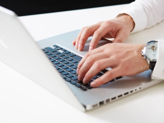 Applicant submitting an application form using a computer